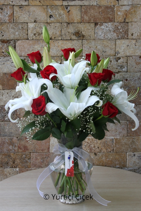 Lilies and 9 Roses in a Vase